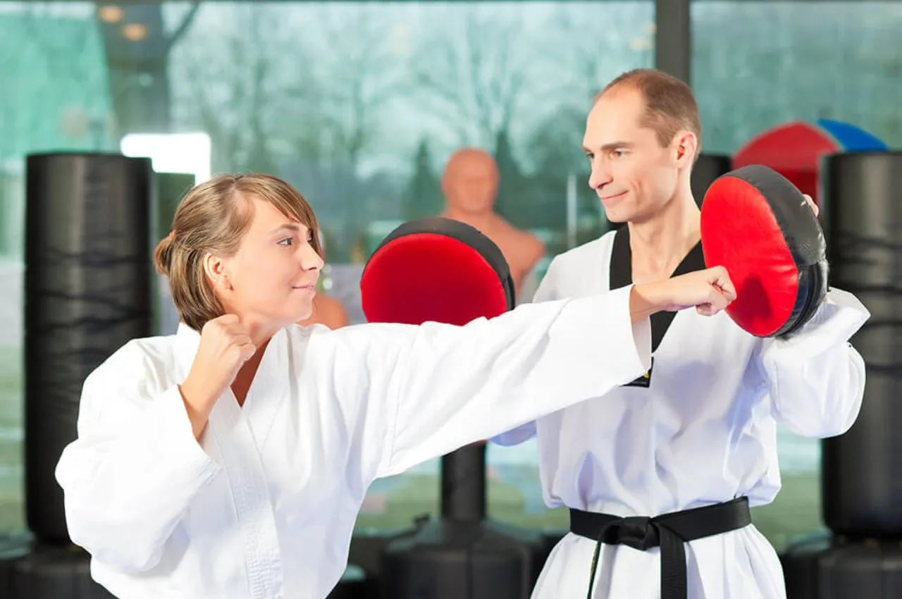 Adults enjoying a fat-burning martial arts workout