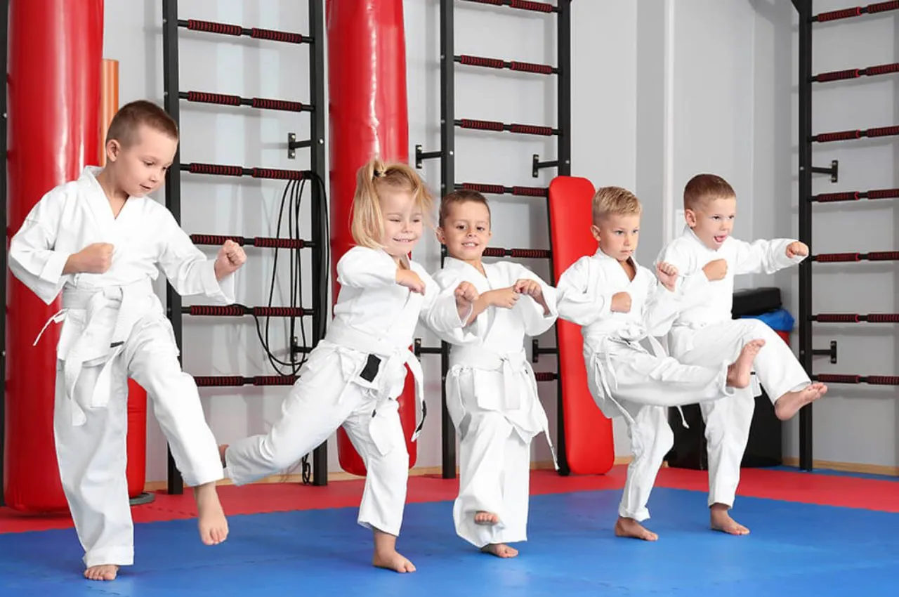 Kids learning sportsmanship through martial arts
